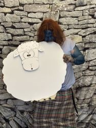 A Nac Mac Feegle biting a sheep