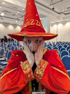 Rincewind with his hands to his face, shocked